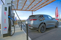 Electric car that charges at a terminal